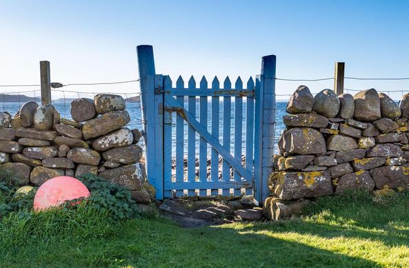 Blue gate. Blue sea beyond.